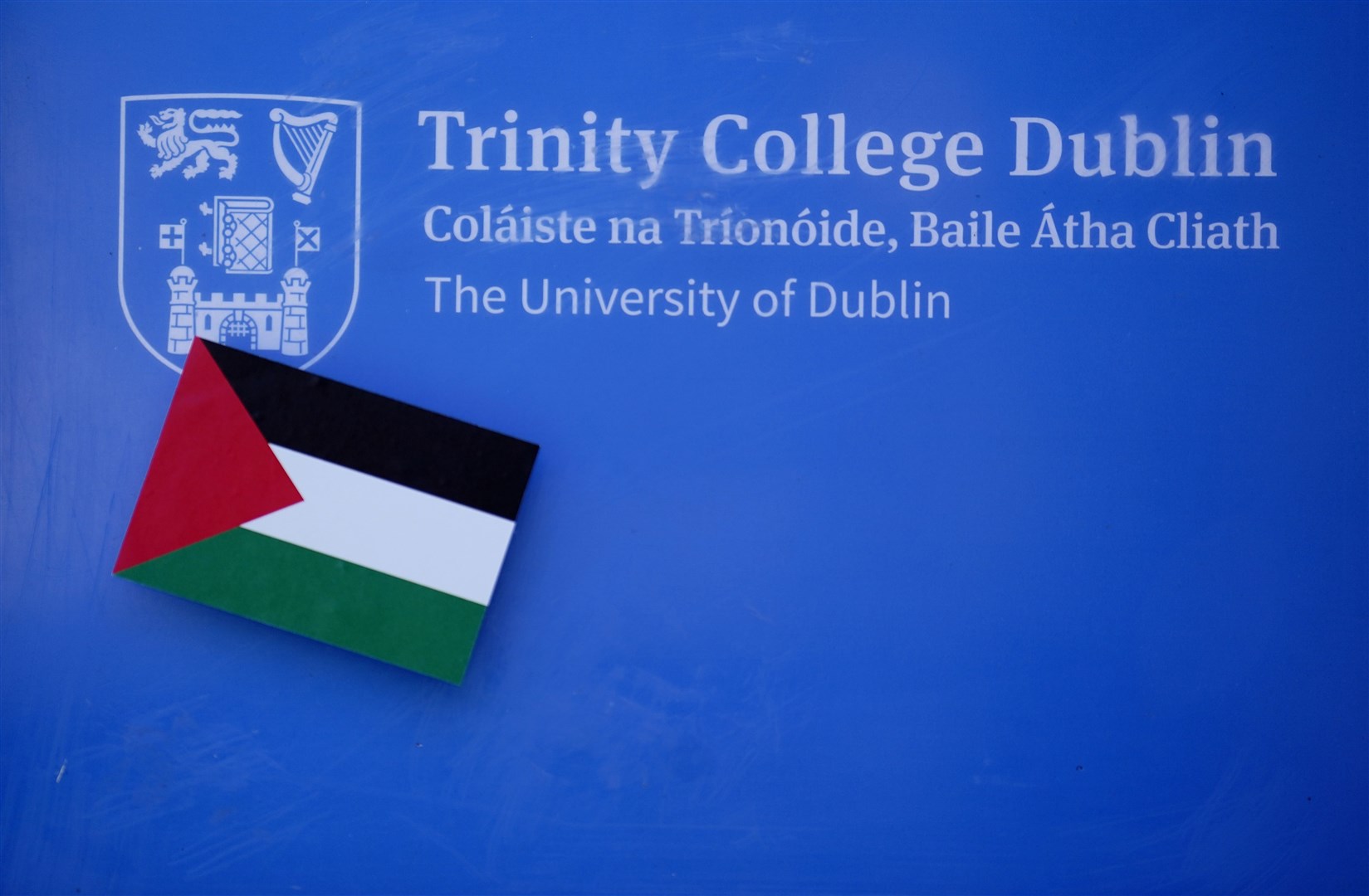 A Palestine sticker on a sign at the entrance to Trinity College in Dublin (Brian Lawless/PA)