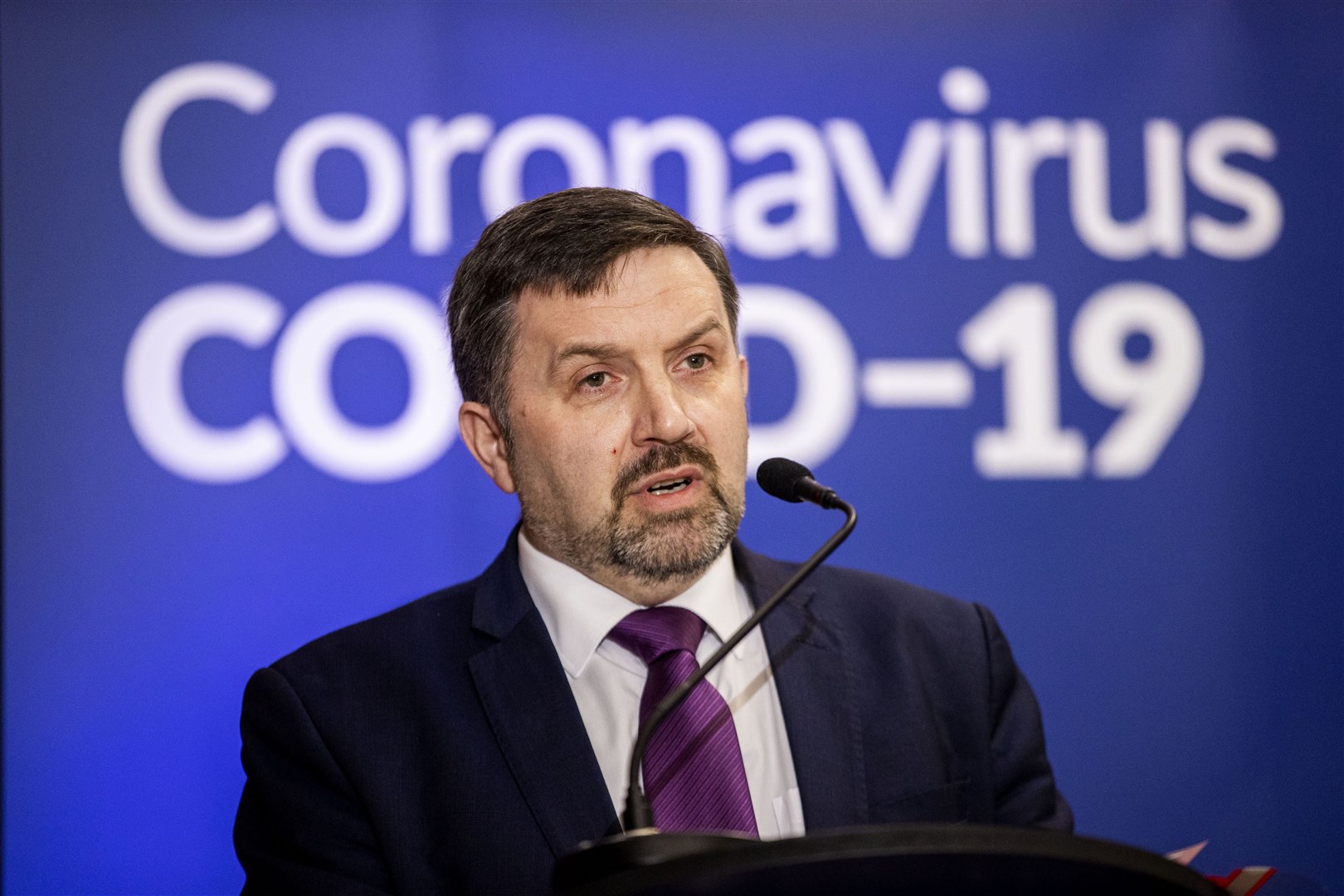 Health Minister Robin Swann during a daily press update on the response to the Covid-19 crisis in 2020 (PA)