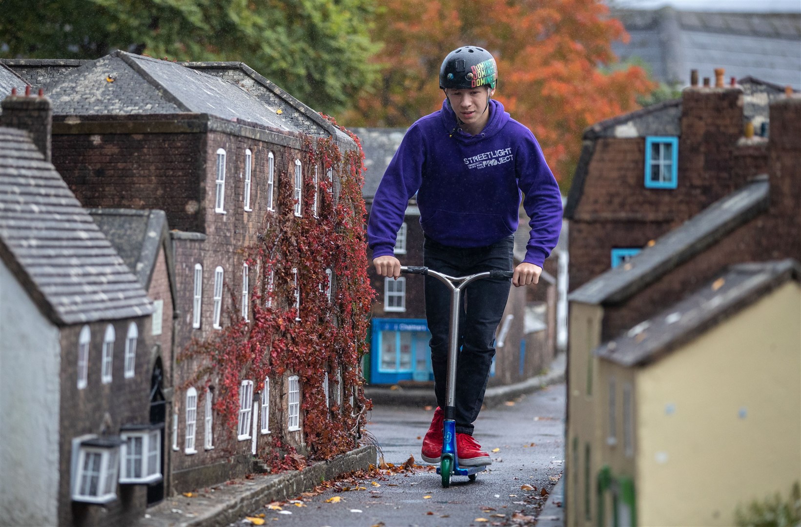 Jack Hopton-Butler dwarfed the buildings of the model town (Andrew Matthews/PA)