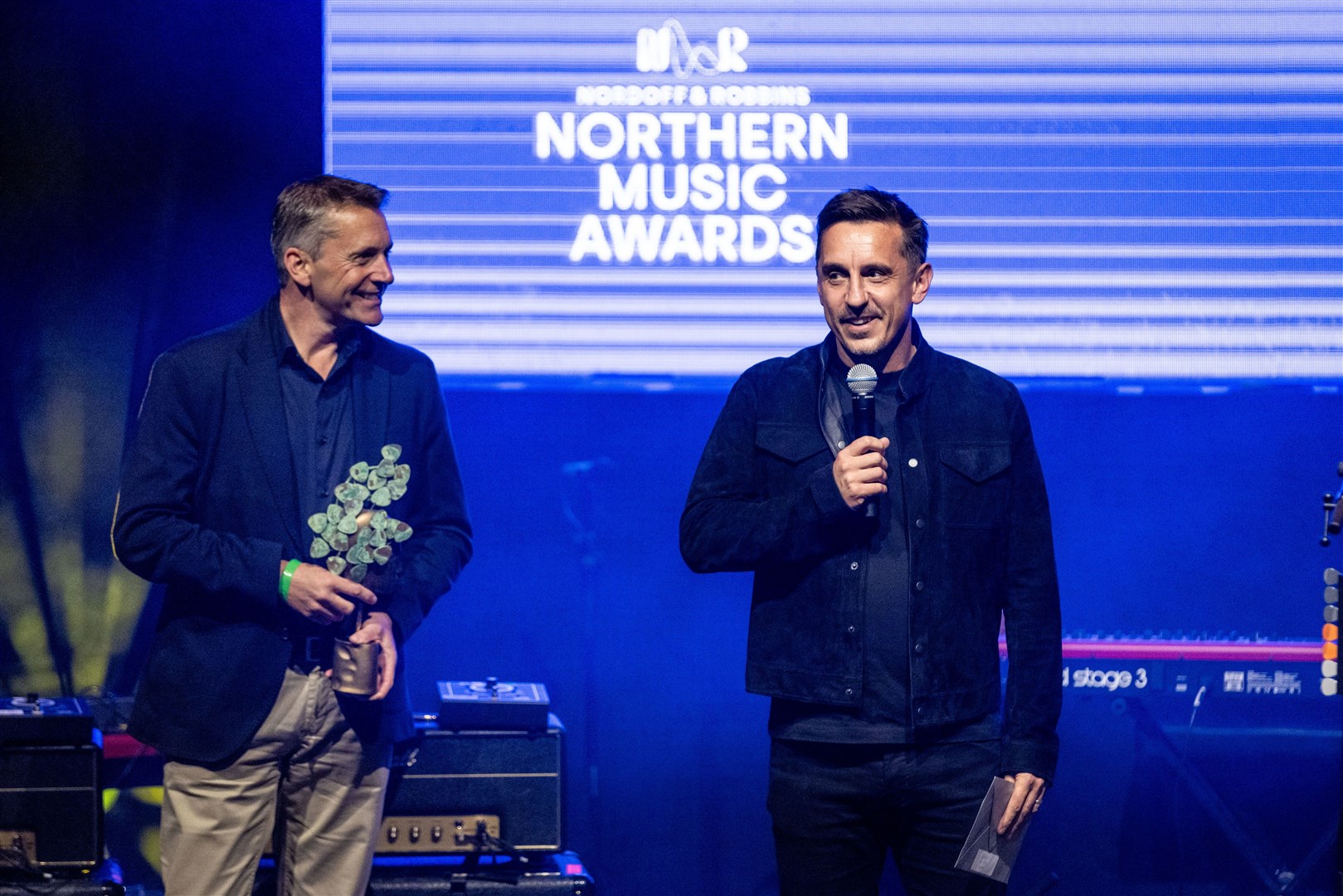 Gary Neville presents the best band award to The Courteeners at the first Nordoff and Robbins Northern Music Awards (James Speakman/PA)
