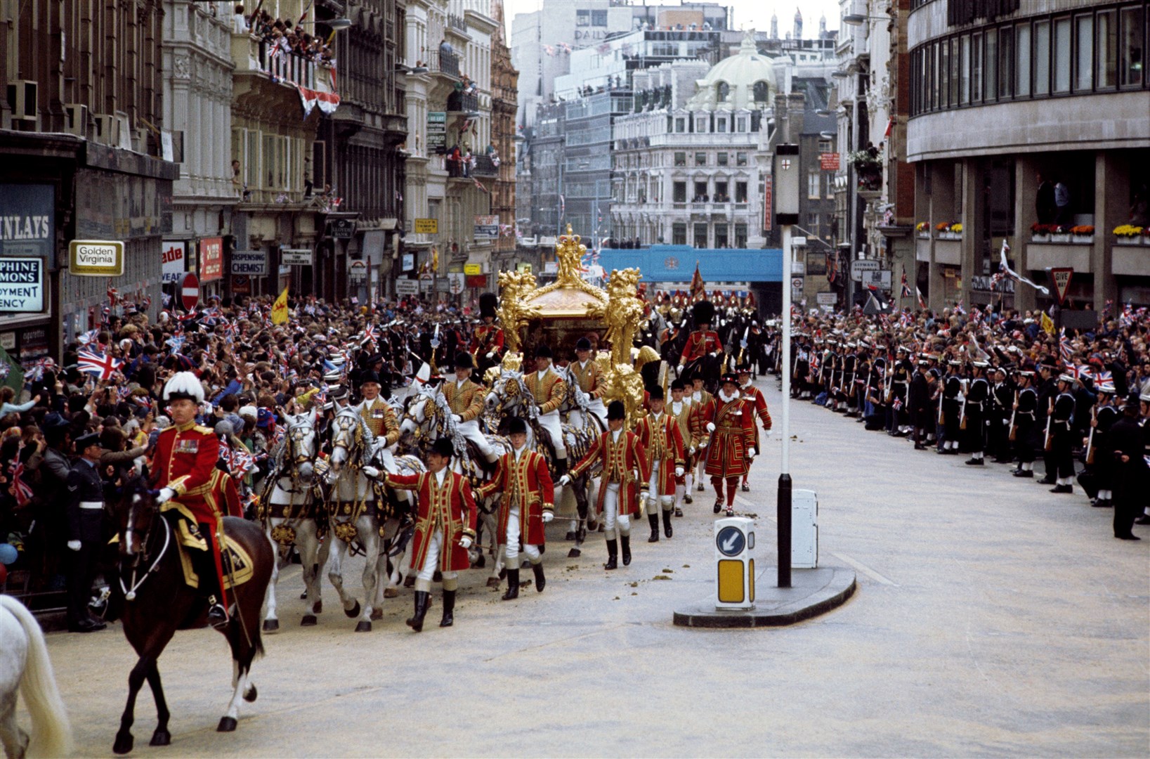 The Queen and Philip in the Golden State Coach after leaving Buckingham Palace for St Paul’s Cathedral to attend a service of thanksgiving for the Silver Jubilee in 1977 (PA)