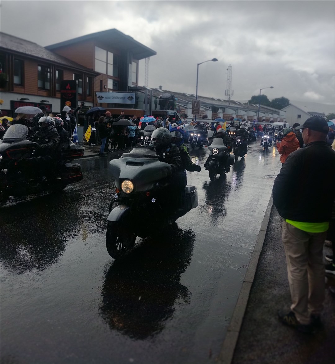 RAIN-OUT 2024: Many in the crowd literally did a countdown to noon, knowing the cloudburst would come right on time as the police escort appeared with the first of riders of the grand procession to Grantown.