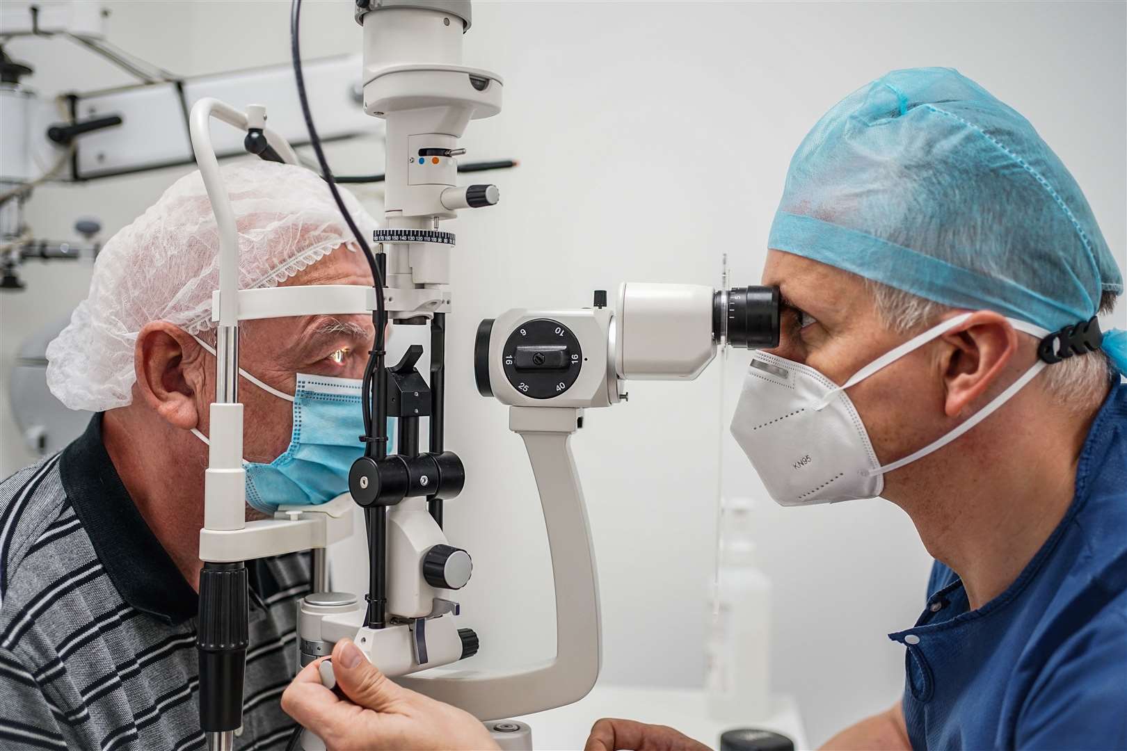 Optical Express ophthalmic surgeon David Teenan with a patient.