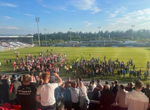 The pitch invastion at full time at the Caledonian Stadium.