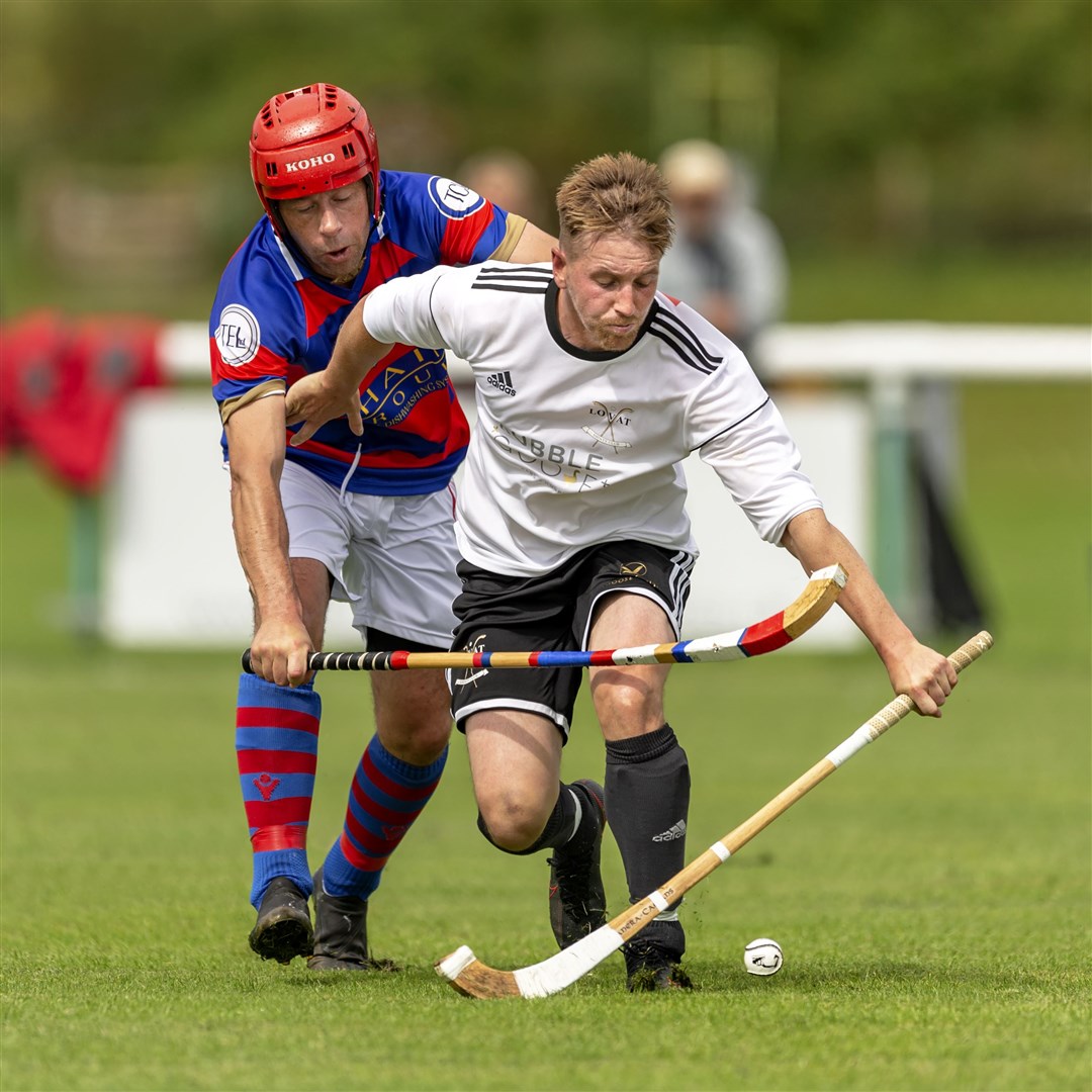 James Hutchison (Kingussie) gets a tackle in on Lovat’s Lorne Mackay in an Artemis MacAulay Cup semi final (north) at Braeview Park in Beauly.