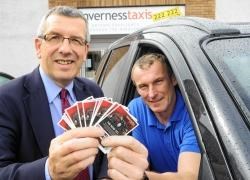 MSP David Stewart and Gavin Johnston, of Inverness Taxis.