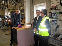 from left to right, Jim DeBank, Cycling Co-ordinator, New Start Highland, James Dunbar, New Start's Chief Executive, and MSP David Stewart