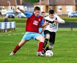 Lybster defender Stevie Shepherd tackles Swifts striker Chris Sutherland.lybs