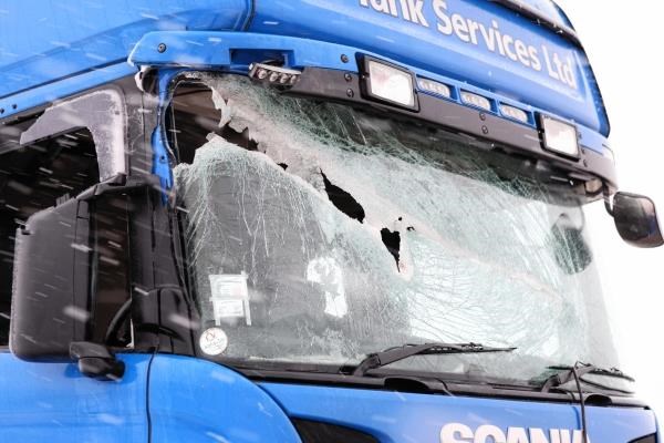 The damaged window of the lorry after the pipe went though it