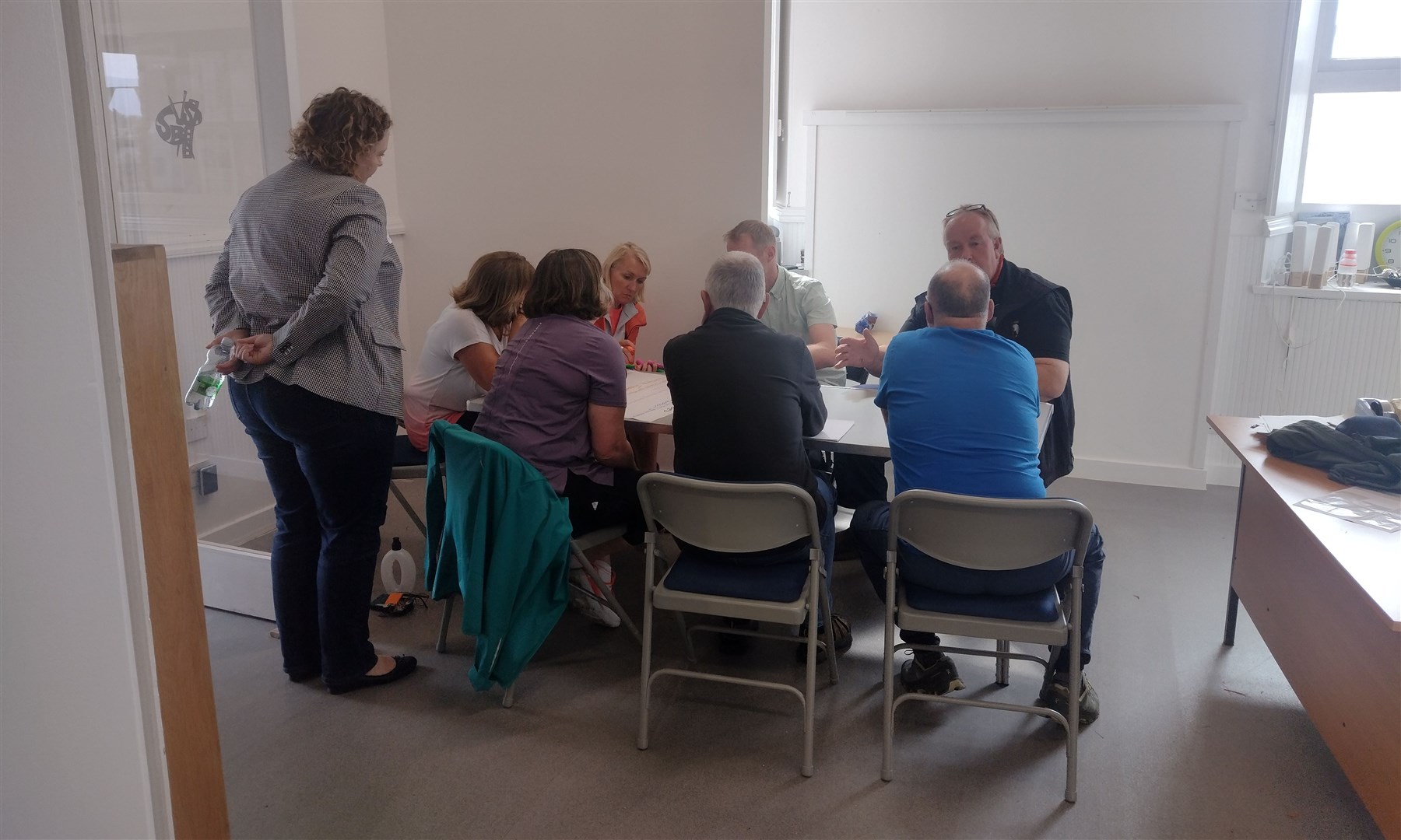 GROUP CHAT: One of the four groups which split up after the welcome to Kingussie's Burall Fund consultation