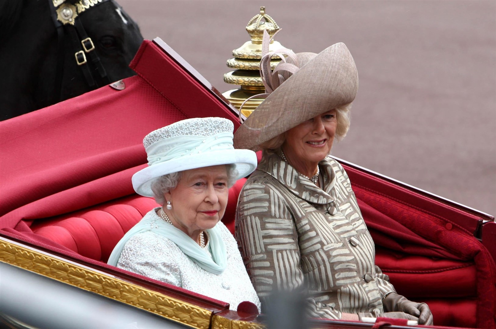 Queen Elizabeth II and the Duchess of Cornwall riding side by side in a carriage to Buckingham Palace during the Diamond Jubilee celebrations (David Jones/PA)