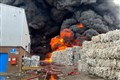 Black smoke seen as firefighters tackle large fire at recycling warehouse