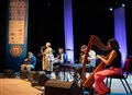 Glenfinnan Ceilidh Band perform on stage awith special guest Gaelic singer, Margaret Stewart Eden Court Theatre on the openng night of live music, The Royal National Mòd 2021