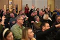 The audience put up their hands when asked if they feel let down and angry about the delay to the A9 dualling project. Picture: James Mackenzie.