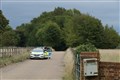 Man quizzed in officer murder probe as shooting suspect remains critically ill