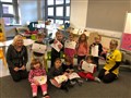 The youngest pupils show off their Pudsey artwork.
