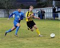 Thistle's Cameron Lisle (left) goes shoulder to shoulder with Liam Shewan (Nairn County).