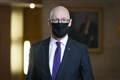 Swinney defends Manchester travel ban decision
