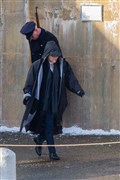Wearing a jacket to keep warm Cillian Murphy, as Thomas Shelby, smokes during a gap in filming. ..Picture: Daniel Forsyth..