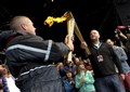 Rockness 2012 ex police chief inspector Blair Marquis handed over the Olympic torch to one of the RockNess promoters Jim King on stage. Picture: HNM/ Callum Mackay