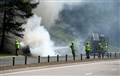 The flames are extinguished by fire crews.