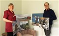Duncan Rennie and Catherine Ellwood with some of his images.