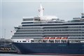 Cruise liner sails into port after crew members test positive for Covid-19