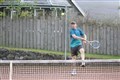 Grant Davis hits a ball with plenty of top spin.