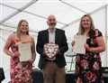 Rose Broadhurst and Lucy Edmondson receive their Service to School Community Award from Ewen Mackintosh.