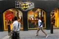 Dr Martens warns over earnings after warm weather drags on sales