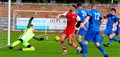Strathspey Thistle stopper Michael MacCallum is at full stretch as teammates Richard Tawse and Martin Duncan look on. Pic: John Mcintyre