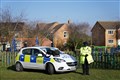 Police seal off woodland as teenager held on suspicion of murder of boy, 16