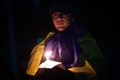 Man with candle. Picture: Callum Mackay..