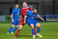 Lossie's Connor Macaulay cries in agony as James Fraser lands his studs on him.