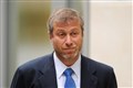 Briton freed from captivity says Roman Abramovich welcomed them onto plane