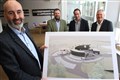 MD Ewen Mackintosh (left) shows off the eye-catching design during the pre-application consultation in Grantown as other project leaders look on.