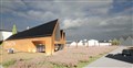 An artist's impression of the new visitor centre and landscape around it.