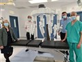 Emma Watson, Deputy Medical Director (Acute); Alan Grant. Clinical Director for Surgery, Anaesthesia and Critical Care; Kenny Oliver, Service Manager for Theatres; and Colin Richards, Consultant Colorectal Surgeon next to DaVinci Xi.