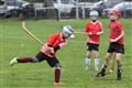 Gaelic Medium shinty Coaching Session taking place prior to the men and women's Mod Shinty Cup matches at Bught Park Inverness at The Royal National Mòd 2021 in Inverness, Scotland