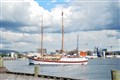 A tourist boat sails into port.