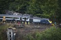 Minute’s silence held as first carriage recovered from train crash site