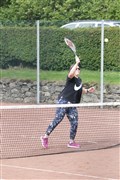 Lisa Carlisle puts away a volley at the net.