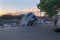 Lorry partially submerged in harbour plunge