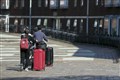 How can university students return home safely for Christmas?