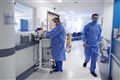 Hospitals across south-eastern England cancel treatments as Covid cases rise