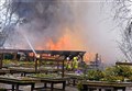 Firefighters battle the devastating blaze at the Heather Centre in April 2016.