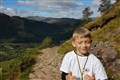 Seven-year-old with cerebral palsy completes Ben Nevis climb for charity