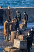 Extras wear Covid masks during a break in filming at Portsoy in February 2021. Picture: Daniel Forsyth