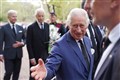 King and Queen shake hands with well-wishers at Clarence House