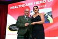 Andy Kent accepting the Healthcare award from Amber Rickard of Inverness Flooring. Picture: James Mackenzie.